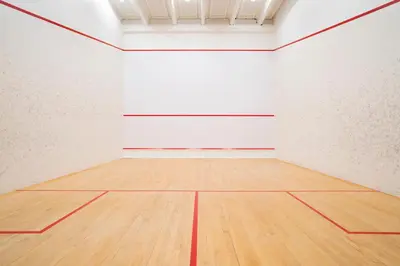 an empty gymnasium with a wooden floor and white walls at Thon Hotel Bergen Airport in Bergen