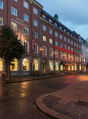 a large building on a city street at night at Thon Hotel Rosenkrantz Bergen in Bergen