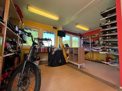 a room with a bike parked in it at Gjøvik Hovdetun Hostel in Gjøvik