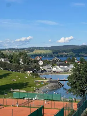 a view of a river with people swimming in it at Gjøvik Hovdetun Hostel in Gjøvik