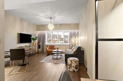 a living room with a couch and a table at Ole Bull, Best Western Signature Collection in Bergen