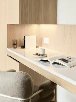 a desk with two books on it with a chair at Hotel 1904 in Ålesund