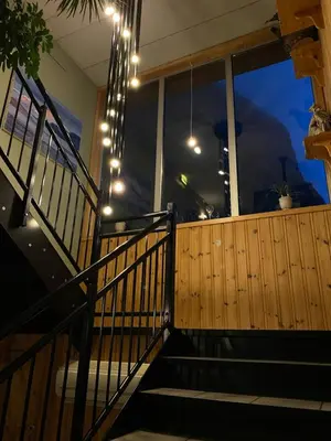 a set of stairs with lights in a house at Trædal Hotel in Sunndalsøra