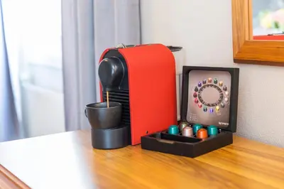 a red toaster sitting on top of a table at Thon Hotel Backlund in Levanger
