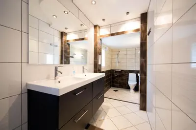 a bathroom with a sink and a toilet at Pensjonat Jarlen in Trondheim