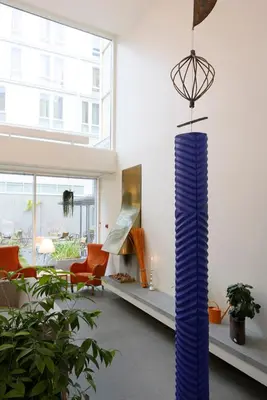 a living room with a large blue vase in the middle at Hotel St. Olav in Trondheim