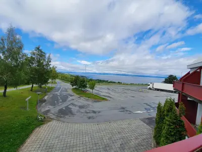 an empty parking lot in front of a building at Stav Hotel in Malvik