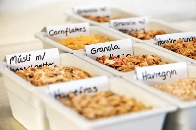 a group of containers filled with different types of food at Tyrifjord Hotell in Vikersund