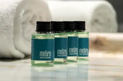 three glass bottles of medication sitting on a bathroom counter at Tyrifjord Hotell in Vikersund