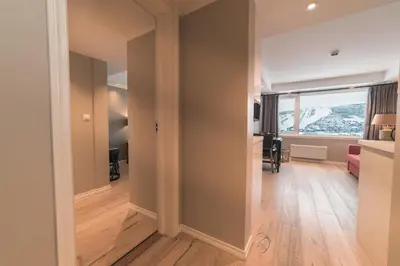 an empty hallway with a room with a window at Ustedalen Hotel Geilo in Geilo