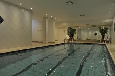 a large swimming pool in a hotel room at Ustedalen Hotel Geilo in Geilo