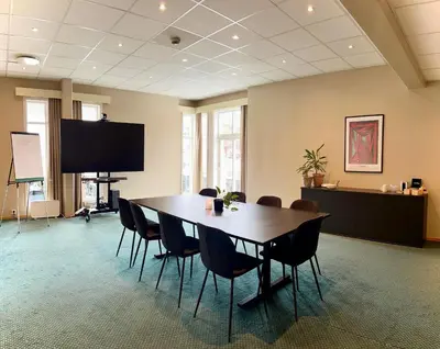 a large conference room with a table and chairs at Ryfylke Fjordhotel in Sand