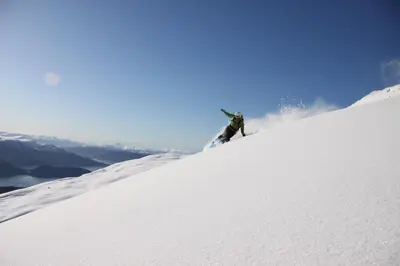 a person is skiing down a snow covered slope at Frich`s Hotel Surnadal in Surnadal