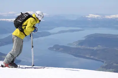 a person on skis standing on top of a mountain at Frich`s Hotel Surnadal in Surnadal