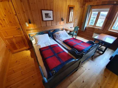 an overhead view of a bedroom with a bed and a table at Vertshuset Røros in Røros
