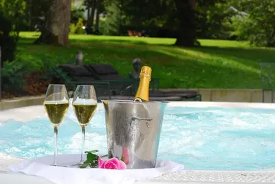 two glasses of wine in a bucket in a swimming pool at Sundvolden Hotel in Sundvollen
