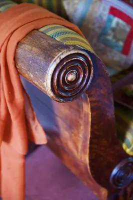 a close up of the end of a wooden chair with a towel at Vangsgaarden Gjestgiveri in Aurland