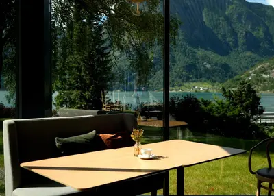 a table in front of a large window at Trolltunga Hotel in Odda