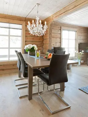 a dining room with a table and chairs at Stranda Fjellgrend in Stranda