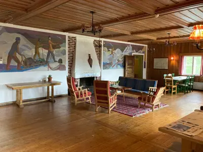 a living room with a large painting on the wall at Voss Mountain Lodge in Mjølfjell