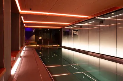 a swimming pool in a building with lights at Bergstadens Hotel & Spa in Røros