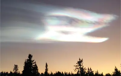 an eye shaped cloud in the sky over trees at Nordseter Sportell 271 in Lillehammer