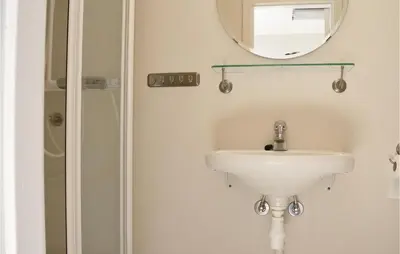 a bathroom with a sink and a mirror at Nordseter Sportell 271 in Lillehammer
