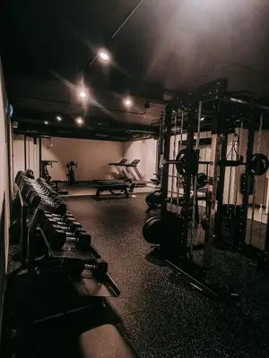 a gym with a bunch of machines in a room at Hotel Noreg in Ålesund