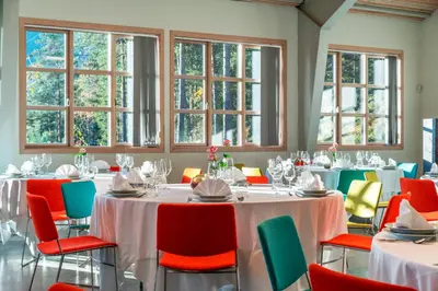 a conference room with tables and chairs and windows at Thon Hotel Bjørneparken in Flå