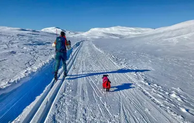 a man and a child on skis in the snow at Beautiful Home In Vøringsfoss With Wifi in Maurset