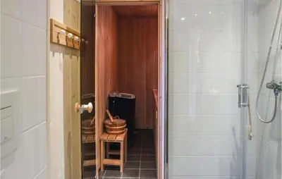a bathroom with a shower and a sink and a toilet at Nice Home In Lillehammer With Sauna in Lillehammer