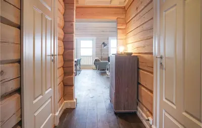 a hallway with wooden walls and a desk in a room at Sjusjøen Setergrend 4724 B in Sjusjøen
