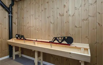 a pair of skis sitting on a wooden bench at Sjusjøen Setergrend 4724 B in Sjusjøen