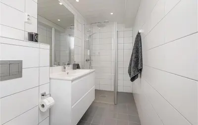 a white bathroom with a sink and a mirror at Sjusjøen Setergrend 4724 C in Sjusjøen