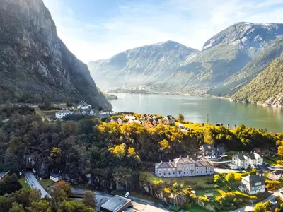 an aerial view of a town in the mountains at Slottet Apartments in Tysso