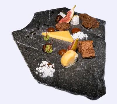 a plate of food with cheese and other desserts at Angvik Gamle Handelssted - by Classic Norway Hotels in Angvik