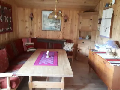a living room with a table and a couch at Teigen Gard in Lom