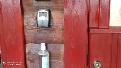 a close up of a door with a soap bottle at Suigard Smia in Sauland