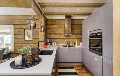 a kitchen with wooden walls and a counter top at Amazing Home In Sjusjøen With Sauna in Sjusjøen