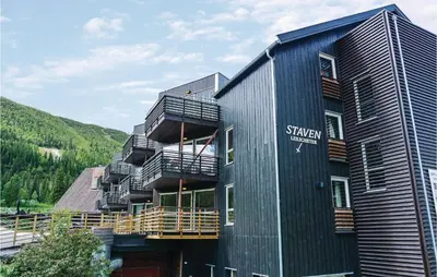 a black building with balconies on the side of it at Cozy Apartment In Hemsedal With Sauna in Hemsedal