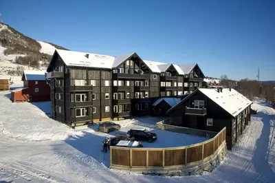 an aerial view of a large building in the snow at Geilo Gaarden in Geilo