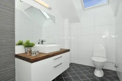 a white bathroom with a sink and a toilet at Geilo Gaarden in Geilo