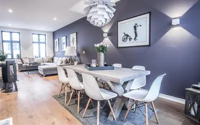 a dining room with a table and chairs at Neumannsgate 4 in Bergen
