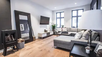 a living room with a couch and a fireplace at Neumannsgate 4 in Bergen