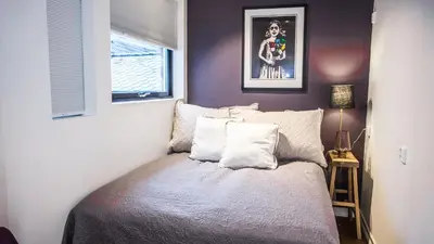 a bedroom with a bed and a window at Neumannsgate 4 in Bergen