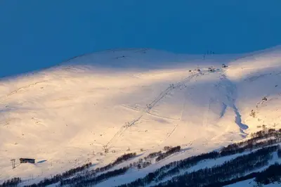 a snow covered mountain with a ski slope at Quality Hotel Skifer in Oppdal