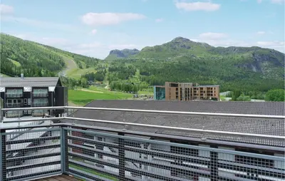 a view from the roof of a building with mountains in the background at Pet Friendly Apartment In Hemsedal in Hemsedal