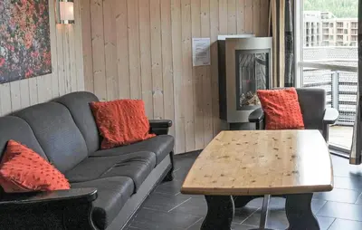 a living room with a couch and a table at Pet Friendly Apartment In Hemsedal in Hemsedal