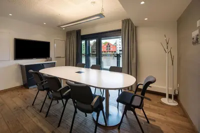 a meeting room with a table and chairs at Scandic Bakklandet in Trondheim