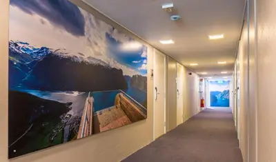 a hallway with a large painting on the wall at Lærdal Hotel in Lærdalsøyri